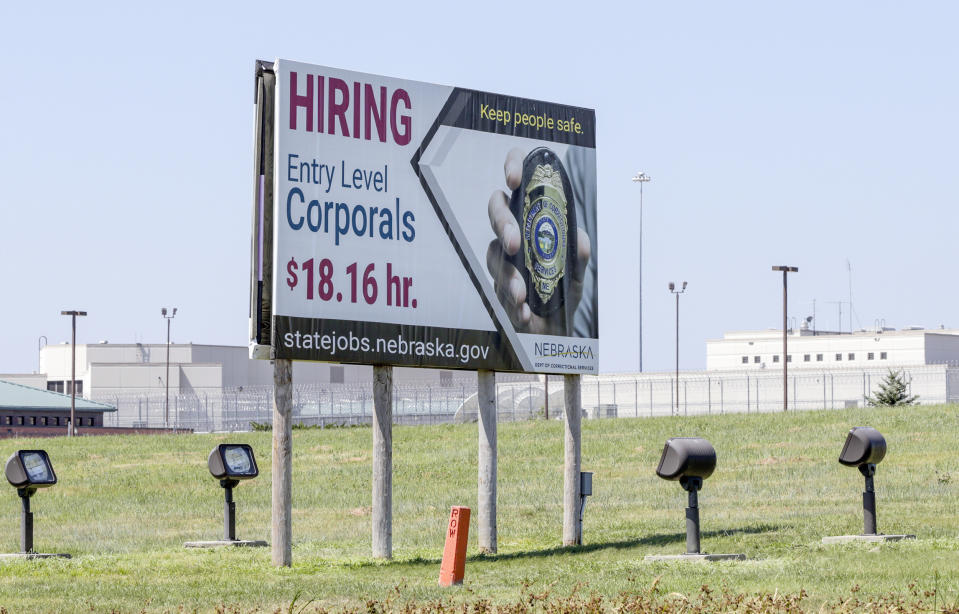 Image: A billboard advertises the availability of jobs with the Nebraska Department of Correctional Services in 2018 (Nati Harnik / AP)