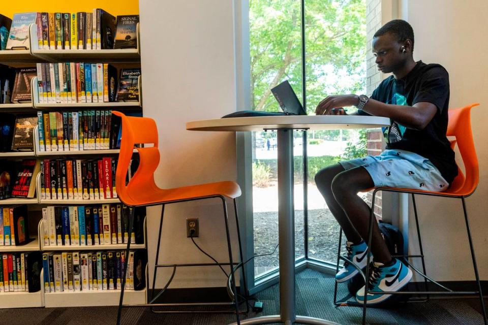 Wake Tech student, Alusine Kamara, studies at the Green Road Library in Raleigh on Tuesday, May 22, 2024.