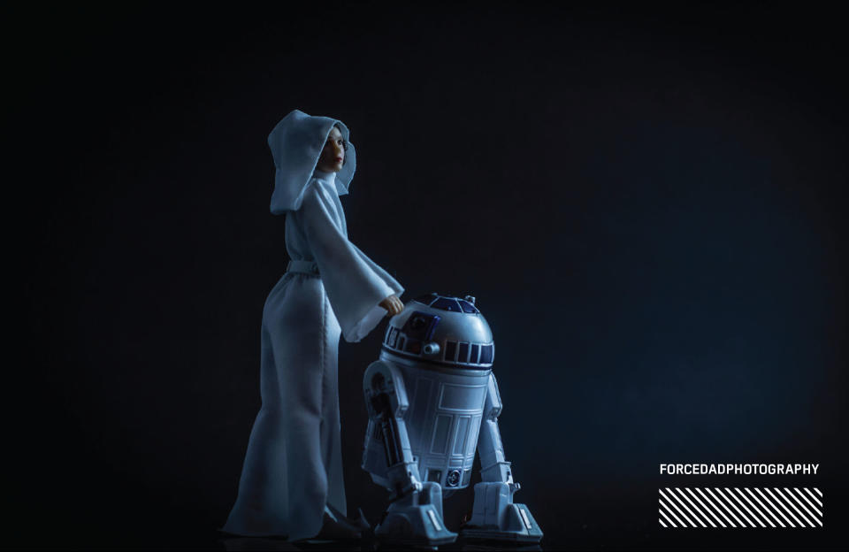 <p>“After the passing of Carrie Fisher there was some fantastic fan art celebrating her (and Kenny Baker’s) life. There was one that touched me titled <em>A Princess Is Once United With Her Astromech… </em>and I wanted to recreate it in a dramatic way. Even though it isn’t a scene in any <em>Star Wars</em> movie, I wanted to make something that evoked that image of saying goodbye to some dear friends.” (Photo: <a rel="nofollow noopener" href="https://www.instagram.com/forcedadphotography/" target="_blank" data-ylk="slk:@forcedadphotography" class="link ">@forcedadphotography</a>/Hasbro) </p>