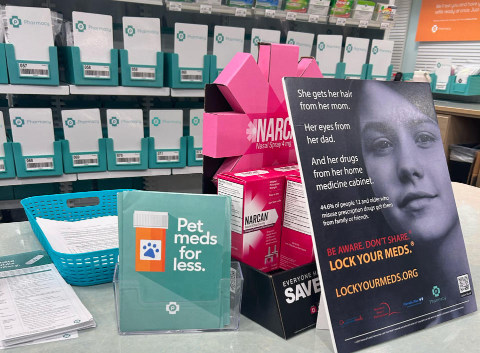 Hiding in plain sight? At a Publix pharmacy in Chattanooga, Tenn., a Narcan display sat on the pharmacy counter, but it was nearly obscured by placards and pamphlets. (Heather Holley / NBC News)