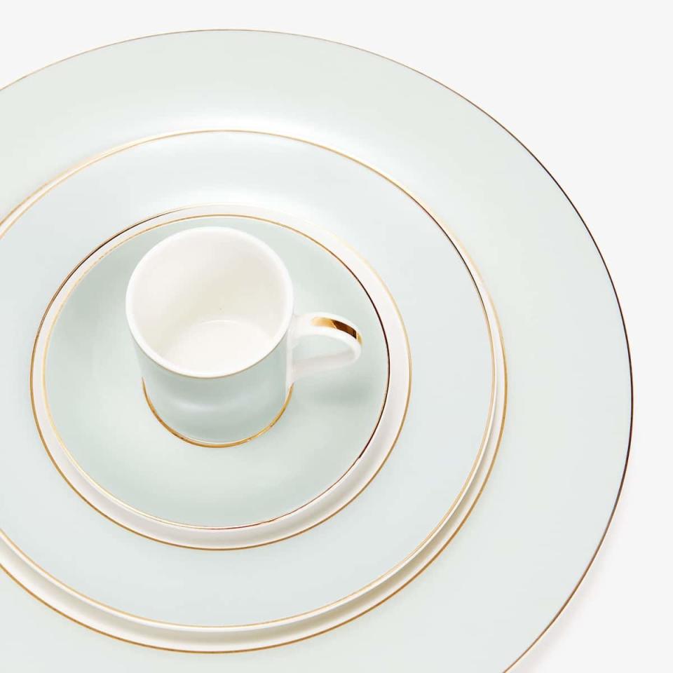 <p>This cup and saucer set will make you feel like you're dining at a fancy French patisserie every day of the week.</p> <p><strong>Shop It Here:</strong> Porcelain dessert set with gold rim, $9.90, <a rel="nofollow noopener" href="https://www.zarahome.com/us/kitchen-&-dining/dinnerware/porcelain-dessert-set-with-gold-rim-c1020117166p300634511.html?colorId=300634511&parentId=300634511" target="_blank" data-ylk="slk:zarahome.com;elm:context_link;itc:0;sec:content-canvas" class="link ">zarahome.com</a></p>