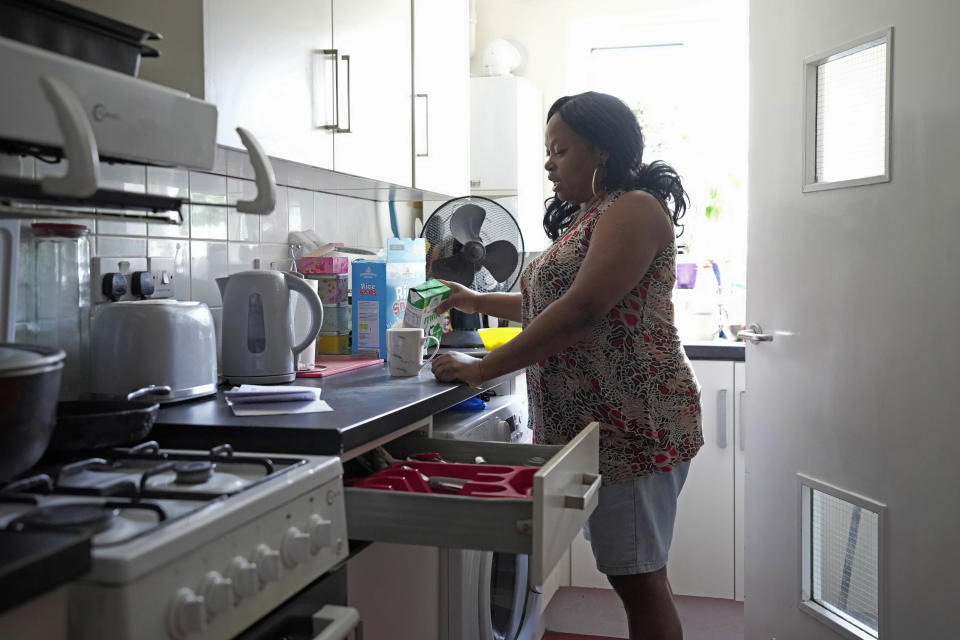 Sadie James makes a cup of tea at her home, in London, Wednesday, July 12, 2023. Sadie James' biggest fear is being evicted from her own home. For Sadie James, the cost-of-living crisis in Britain just never seems to ease. First, it was skyrocketing energy and food costs stemming from Russia's invasion of Ukraine. Now, the 61-year-old worries whether she can keep a roof over her head. (AP Photo/Kin Cheung)