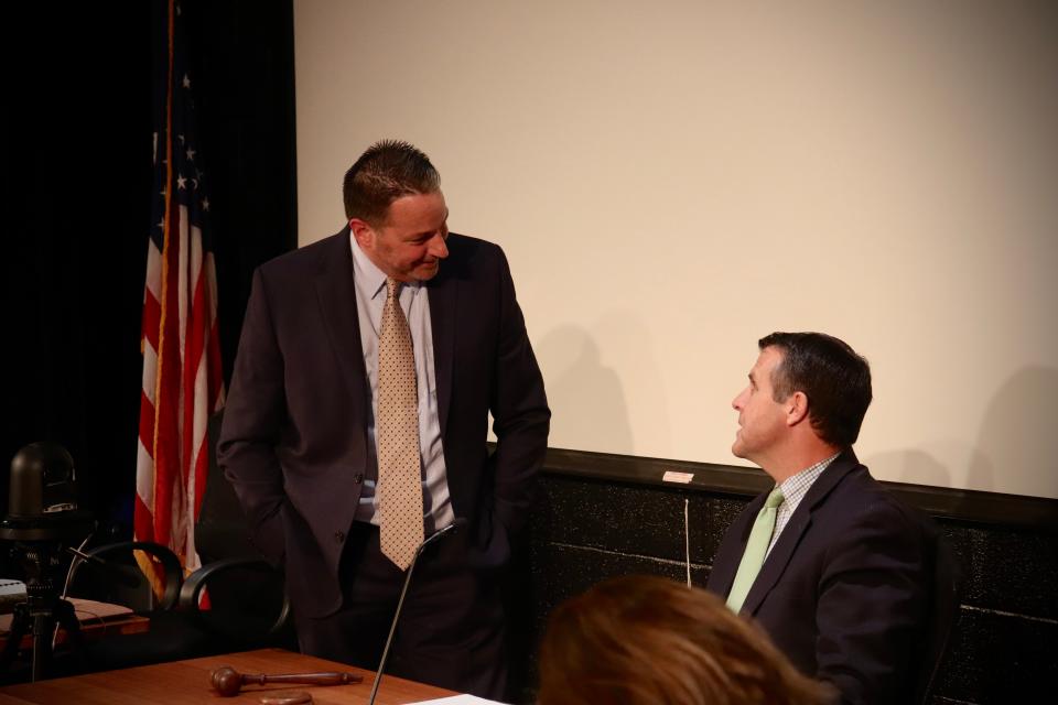 Brockton Mayor Robert Sullivan, right, and Brockton Public Schools Superintendent Mike Thomas talk during a recess at a school committee meeting on May 16, 2023.