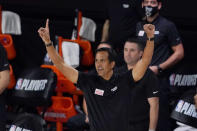 Miami Heat head coach Erik Spoelstra gestures in the second half of an NBA conference semifinal playoff basketball game against the Milwaukee Bucks Friday, Sept. 4, 2020, in Lake Buena Vista, Fla. (AP Photo/Mark J. Terrill)