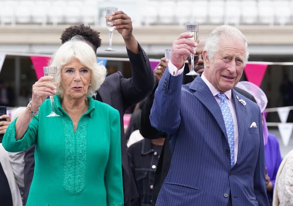 Charles and Camilla make a toast (Stefan Rousseau/PA) (PA Wire)