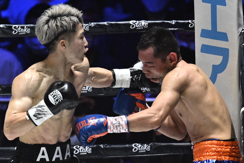 Naoya Inoue (L) de Japón pelea contra Nonito Donaire de Filipinas durante su combate de boxeo de unificación de peso gallo en Saitama Super Arena en Saitama el 7 de junio de 2022. (Foto de Philip FONG / AFP) (Foto de PHILIP FONG/AFP a través de Getty Images)