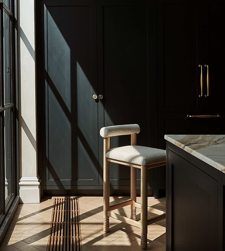 counter stools next to an island