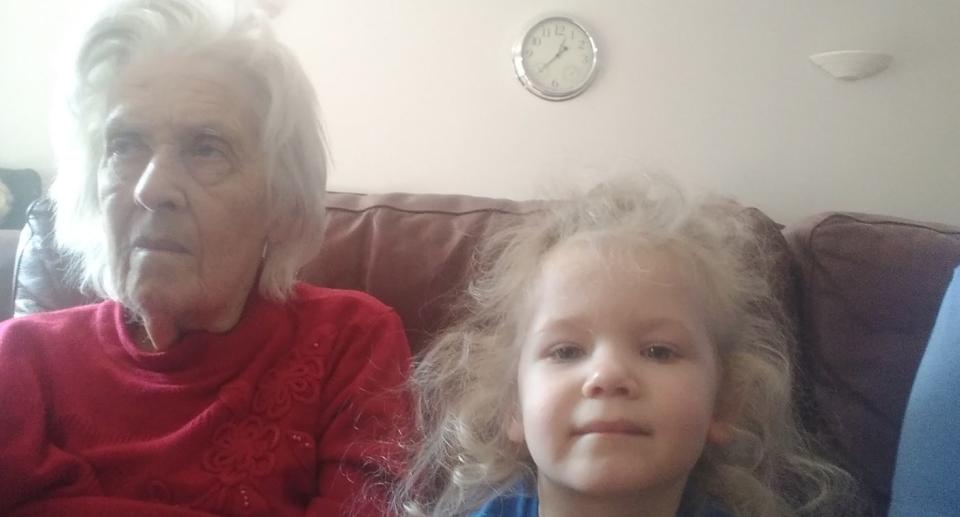 Liz's youngest daughter pictured with her nanny in her first care home in 2019. (Supplied)
