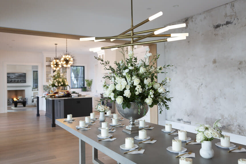 Floral decor and mini cakes at Madison LeCroy and Brett Randle's wedding party in Charleston, South Carolina.