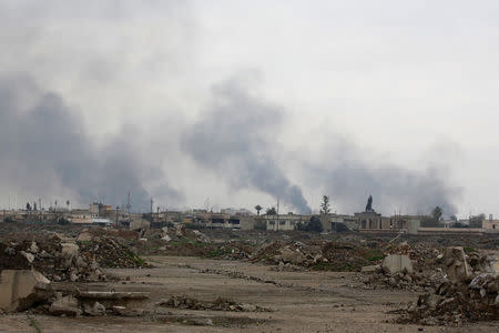 Smoke rises from clashes during a battle between Iraqi forces and Islamic State militants, as seen from Mosul Airport which is being ran by Iraqi forces, in the city of Mosul, Iraq, March 15, 2017. REUTERS/Youssef Boudlal