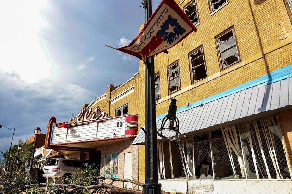 A vehicle sits at the entrance to the Ellis Theater after a tornado struck Perryton, Texas, Thursday, June 15, 2023.