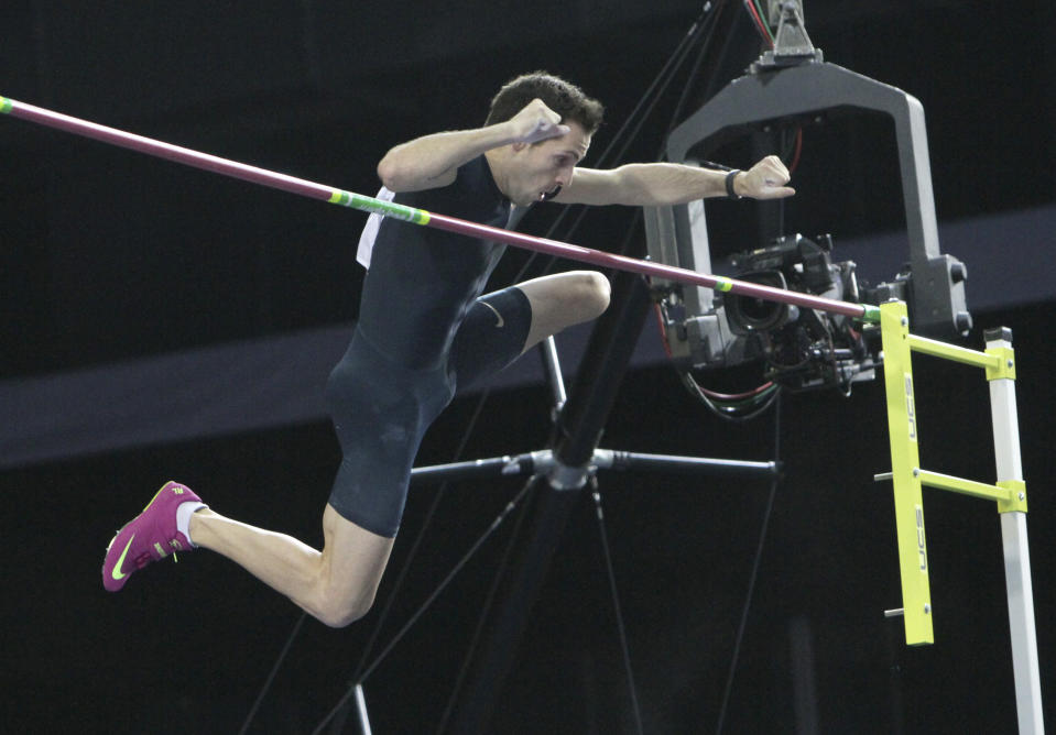 France's Renaud Lavillenie jumps to clear 6.16 meters, a new world record, at the "Pole Vault Stars" event at Donetsk in eastern Ukraine, Saturday, Feb. 15, 2014. Lavillenie broke Sergei Bubka's 21-year-old indoor pole vault world record. (AP Photo)