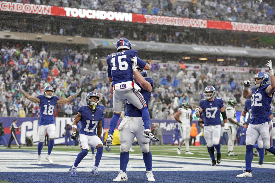 New York Giants quarterback Tommy DeVito (15) runs in the ball for a touchdown during the second half of an NFL football game against the New York Jets, Sunday, Oct. 29, 2023, in East Rutherford, N.J. (AP Photo/Adam Hunger)