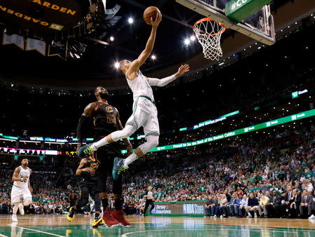 May 23, 2018; Boston, MA, USA; Boston Celtics forward Jayson Tatum (0) attempts a layup in front of Cleveland Cavaliers forward LeBron James (23) during the third quarter of game five of the Eastern conference finals of the 2018 NBA Playoffs at TD Garden. Mandatory Credit: Greg M. Cooper-USA TODAY Sports