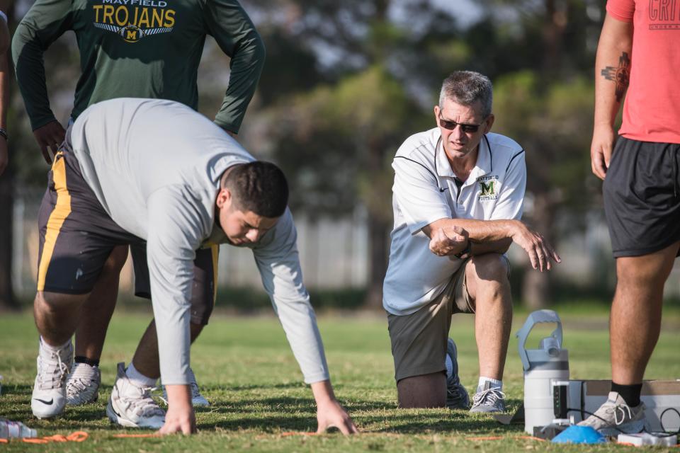 Head coach Michael Bradley runs drills at practice at Mayfield High School in Las Cruces on Wednesday, Aug 4, 2021.