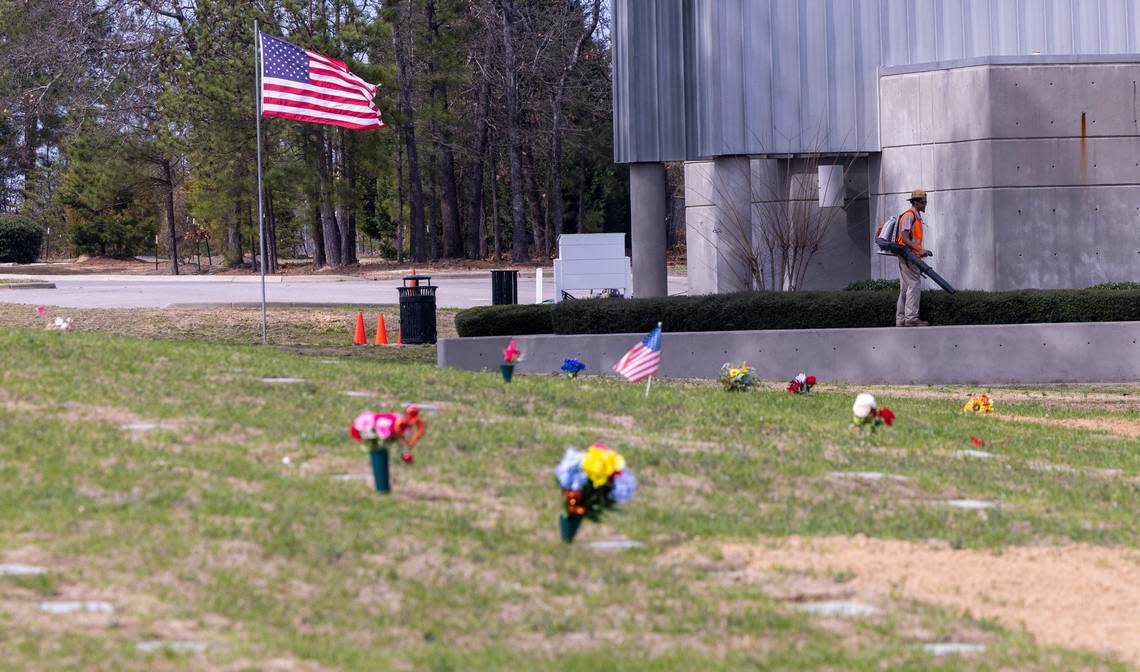 A groundskeeper operates a leaf blower at Sandhills State Veterans Cemetery in Spring Lake Tuesday, Feb 21, 2022. North Carolina’s four state-owned veterans cemeteries are behind on maintenance and are short-staffed.
