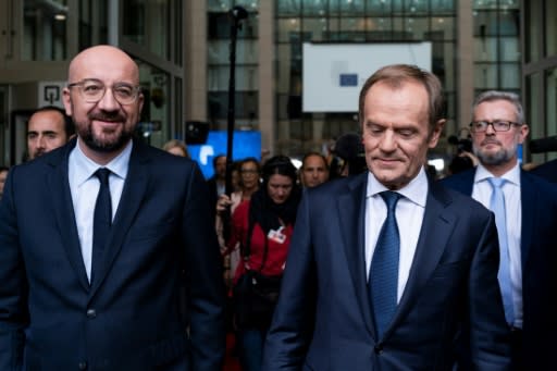 Newly appointed European Council President Charles Michel (L) is aiming for a more 'assertive' EU after taking over from Donald Tusk (R)