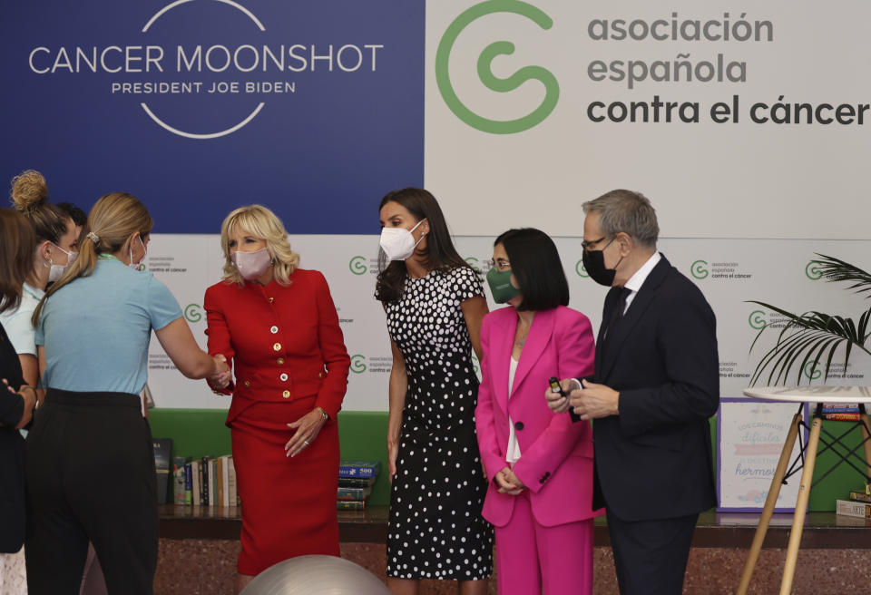 U.S. first lady Jill Biden, center left, and Spain's Queen Letizia, center right, visit the Spanish Association Against Cancer center ahead of the NATO Summit, in Madrid, Spain, Monday June 27, 2022. (Nacho Doce/Pool Photo via AP)