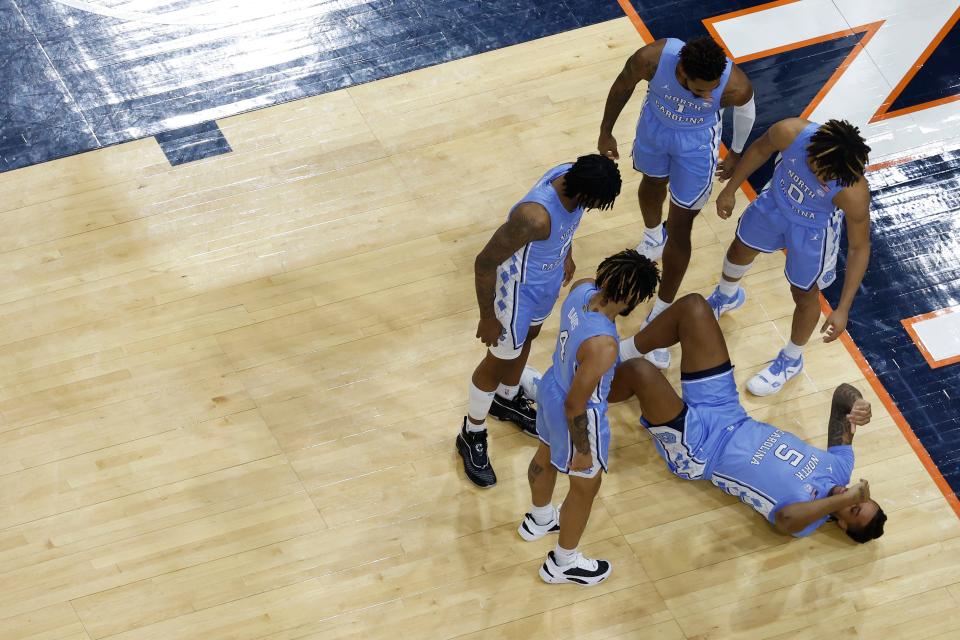 UNC basketball star Armando Bacot went down with an ankle injury early in the first half of the Tar Heels' loss at Virginia.