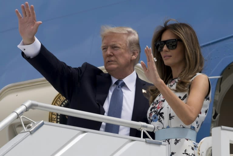 US President Donald Trump (L) and First Lady Melania Trump board Air Force One prior to departing Paris Orly Airport