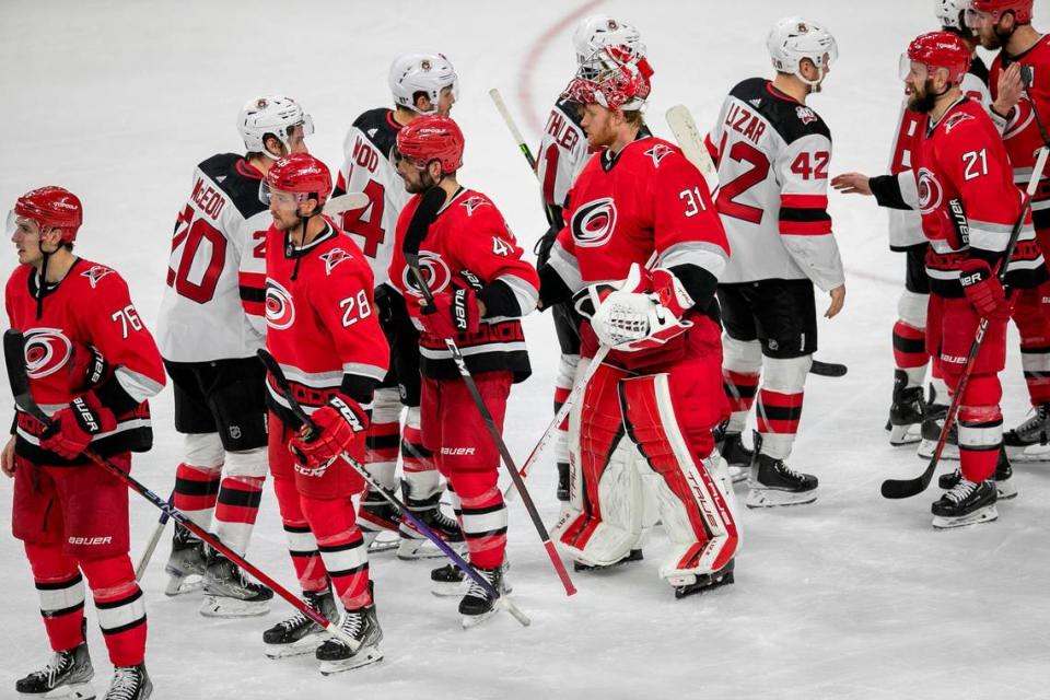 The New Jersey Devils Miles Wood (44) congratulates Carolina Hurricanes goalie Frederik Andersen (31) in the handshake line, following the Hurricanes’ 3-2 overtime victory in Game 5 of their second round Stanley Cup playoff series on Thursday, May 11, 2023 at PNC Arena in Raleigh, N.C.