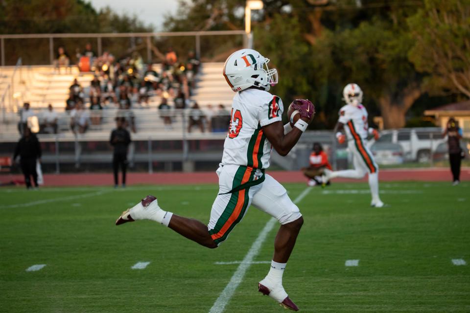 Da'mari Loggins of Dunbar makes a long catch for a touchdown in the opening drive against North Fort Myers on Friday, Sept 1, 2023.