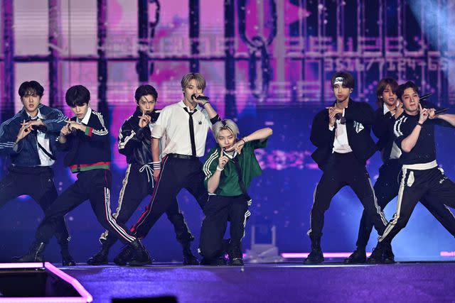 <p>JUNG YEON-JE/AFP via Getty</p> Stray Kids perform in Seoul in August 2022