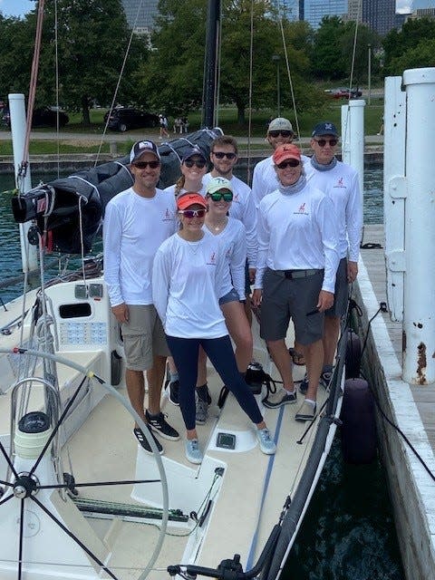 The crew of nosurprise on Monday, July 24, after winning the 2023 Chicago to Mackinac race in 46:27:06 hours. The female sailors, front to back, are Merritt Sellers of Larkspur, California, Meredith Moran of Wilton, Connecticut and Hadley Camp of Harbor Springs, Michigan. The men (from left) are Scott Sellers of Larkspur, Robert Duff of Arlington, Texas, Michael Graham of Cincinnati, Ohio (red cap), Ian Beckley of Madison, Wisconsin (tan cap) and Owen Beckley of Harbor Springs, Michigan.