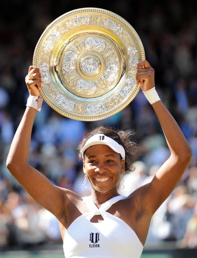 Venus Williams holds her Wimbledon title 