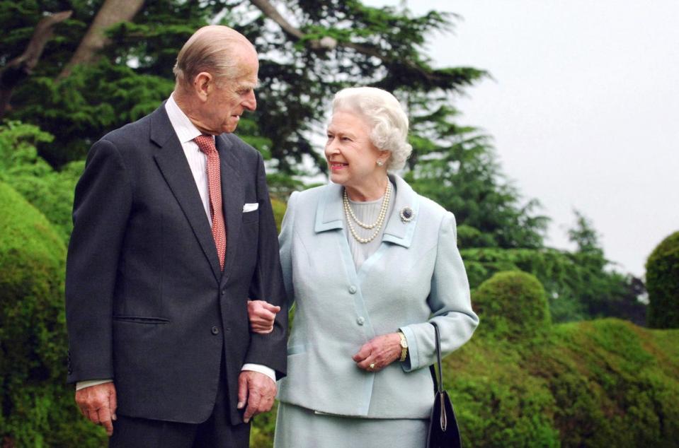 Queen Elizabeth II and her husband, the Duke of Edinburgh walking at Broadlands, Hampshire in 2007 (AFP via Getty)