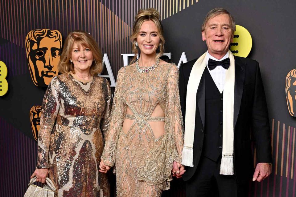 <p> Gareth Cattermole/BAFTA/Getty</p> Emily Blunt with her parents at 2024 BAFTAs