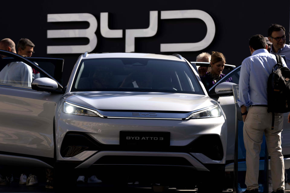 FILE - Visitors check the China made BYD ATTO 3 at the IAA motor show in Munich, Germany, on Sept. 8, 2023. The Chinese government has said it will take "all measures necessary to protect our legitimate rights and interests" in response to the tariffs on Chinese-made electric vehicles but it hasn't specified what those might be. (AP Photo/Matthias Schrader, File)