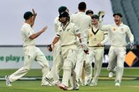 New Zealand batsman BJ Watling walks back to the pavilion following his dismissal by Australian paceman Josh Hazlewood during the third Test at the Adelaide Oval on November 27, 2015