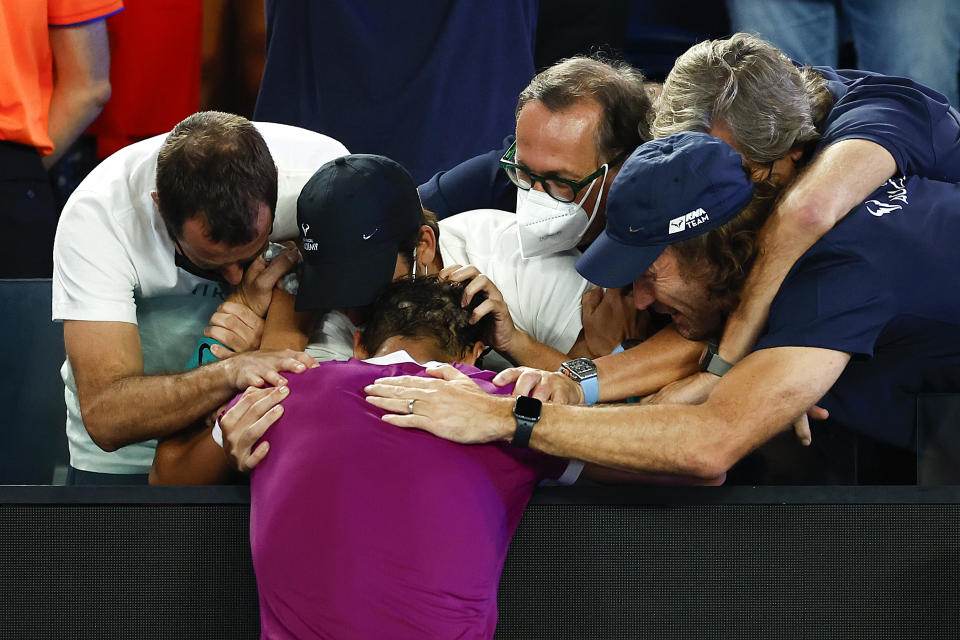 Rafael Nadal, pictured here embracing Carlos Moya and his team after winning the Australian Open.