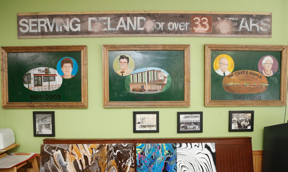 Inside Hunter's Restaurant in DeLand are paintings of the family members who at one point owned the restaurant during its 73-year history. The "serving DeLand" sign was salvaged from an earlier location that burned down in 1981.