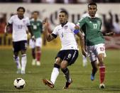 United States' Clint Dempsey (8) passes the ball under pressure from Mexico's Jesus Zavala (17) during the first half of their 2014 World Cup qualifying soccer match in Columbus, Ohio September 10, 2013. REUTERS/Matt Sullivan