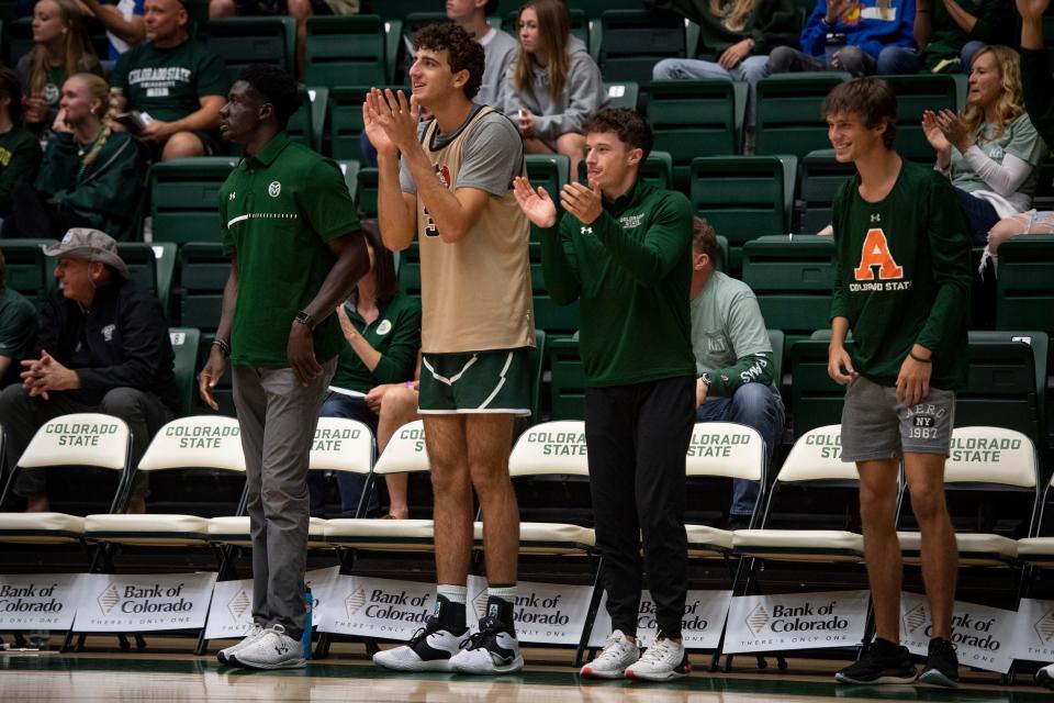Colorado State basketball player Kyle Evans, second from left, cheers on his squad during the CSU men's basketball Homecoming scrimmage in Moby Arena on Saturday, Oct. 15, 2022, in Fort Collins, Colo.