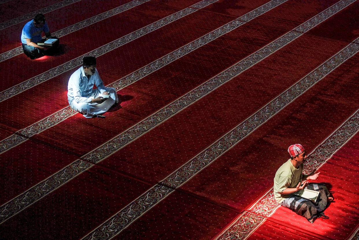 Indonesian Muslims read the Koran at a Mosque in Bandung, West Java during the month of Ramadan. (AFP/Getty)