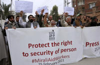 Members of a civil society Mirali Aid Workers chant slogans during a demonstration to condemn the killing of four women who advocated for women's rights by suspected militants in Pakistan's border regions, in Peshawar, Pakistan, Thursday, Feb. 25, 2021. Militant attacks are on the rise in Pakistan amid a growing religiosity that has brought greater intolerance, prompting one expert to voice concern the country could be overwhelmed by religious extremism. (AP Photo/Muhammad Sajjad)