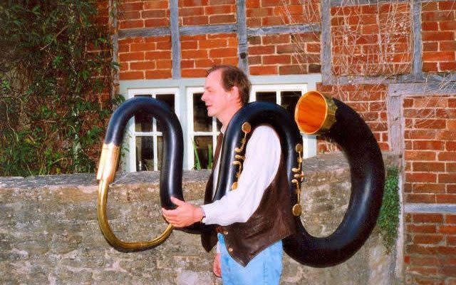 Jeremy West with the great bass serpent, one of the instruments 'people love to see in the showroom'