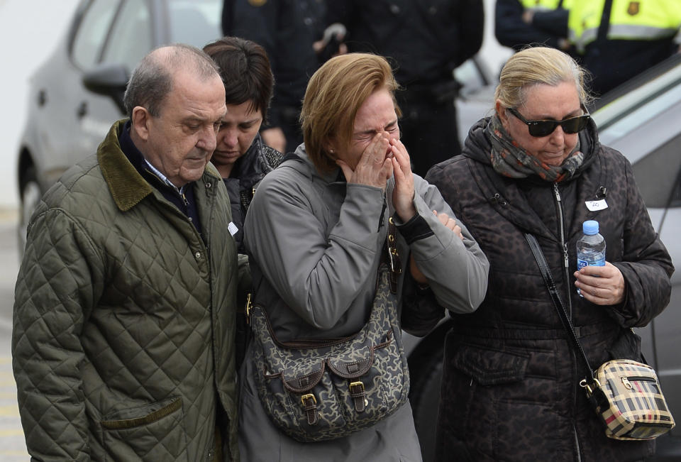 Crying people arrive at Barcelona airport in Spain, Tuesday, March 24, 2015. A Germanwings passenger jet carrying 150 people crashed Tuesday in the French Alps region as it traveled from Barcelona to Duesseldorf in Germany. (AP Photo/Manu Fernandez)