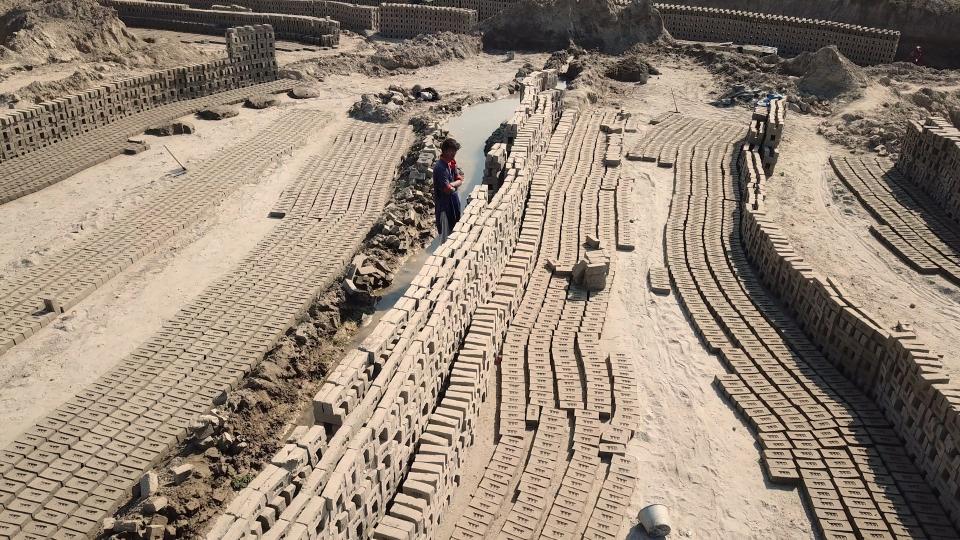 Line of prepared bricks before put into kiln