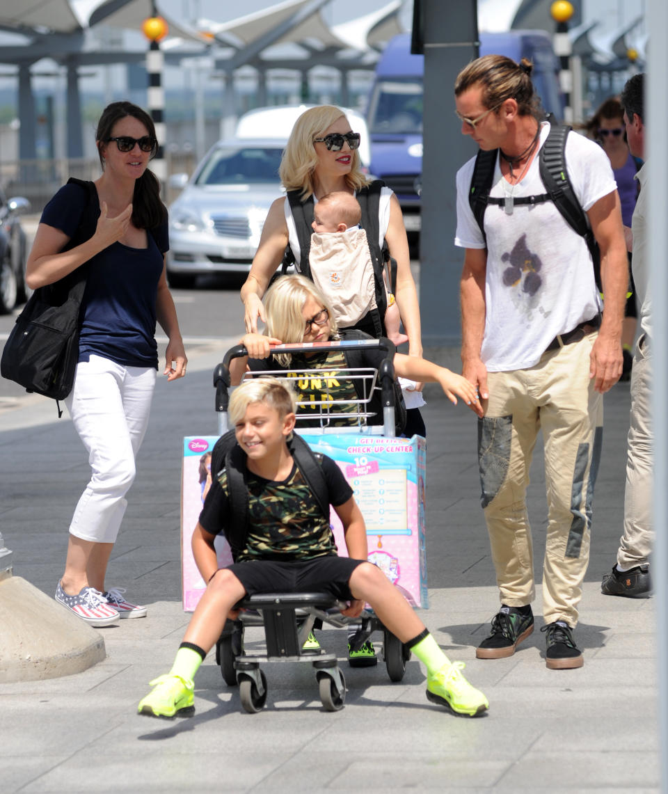 Gwen Stefani and Gavin Rossdale and family pictured at Heathrow Airport on July 24, 2014 in London, England.