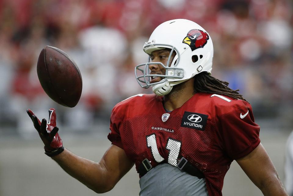 Larry Fitzgerald will help the owner of a local deli who is battling cancer. (AP Photo)