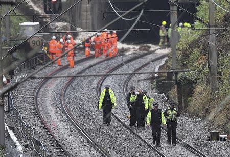 Emergency services and rail workers attend the scene of a train derailment on the Euston to Milton Keynes line, at Hunton Bridge tunnel, north of Watford Junction station, Britain September 16, 2016. REUTERS/Eddie Keogh