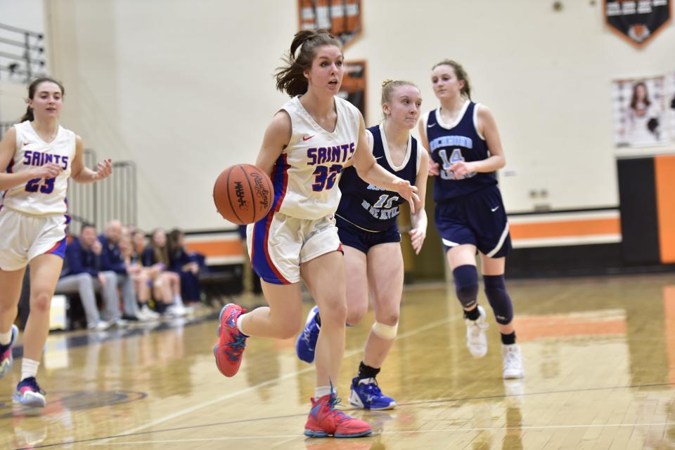 St. Clair's Alexa Vickers drives the lane during the Saints' 47-31 win over Richmond in a Division 2 district quarterfinal at Armada High School on Monday. She finished with eight points.