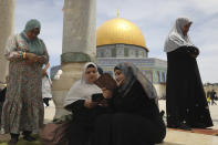 Palestinian women take part in the last Friday prayers of the Muslim holy month of Ramadan at the Dome of the Rock Mosque in the Al Aqsa Mosque compound in the Old City of Jerusalem, Jerusalem, Friday, May 7, 2021. (AP Photo/Mahmoud Illean)