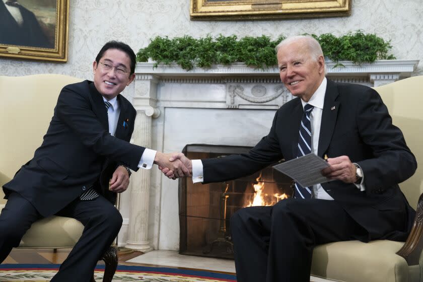 President Joe Biden shakes hands with Japanese Prime Minister Fumio Kishida as they meet in the Oval Office of the White House, Friday, Jan. 13, 2023, in Washington. (AP Photo/Evan Vucci)