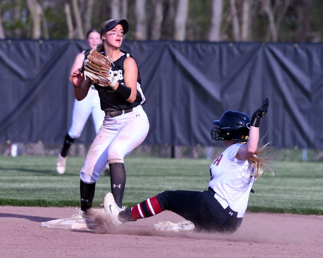 Corning second baseman Kaleigh Sparks forces out Elmira's Kaelynn Thomas at second base during the Hawks' 18-2, five-inning win in a STAC softball game April 29, 2024 at Elmira High School.