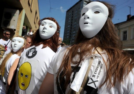 Supporters of female Russian punk band 'Pussy Riot' rally outside a Moscow courthouse on July 4. Members of the all women punk group 'Pussy Riot' who allegedly stormed a Moscow church to sing an anti-Putin song face up to seven years in a prison colony after being charged with hooliganism